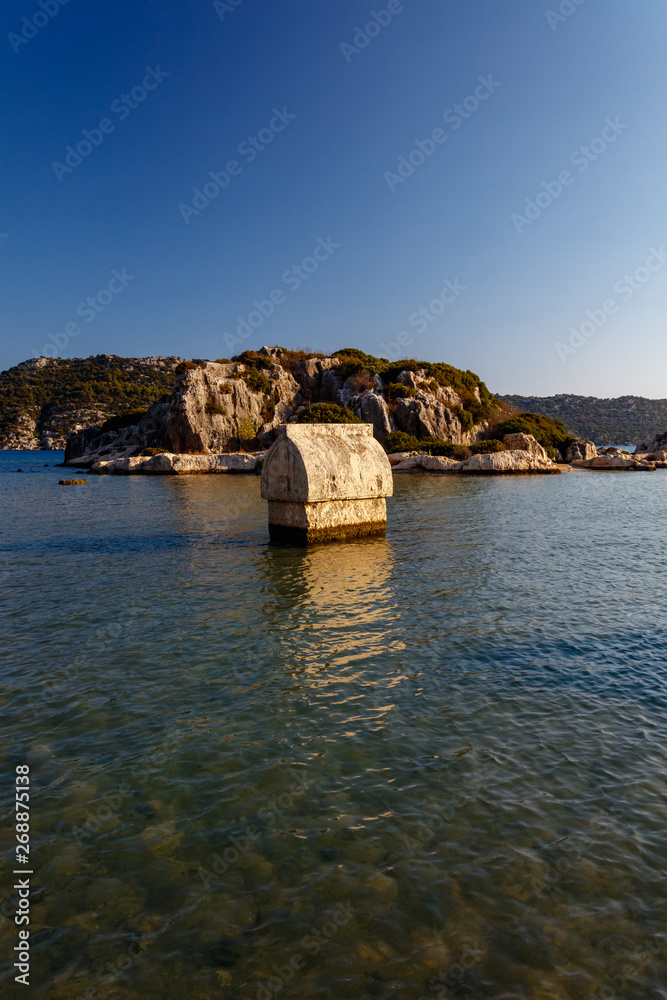 Lycian stone tomb in water, Kalekoy, Kekova, Antalya, Turkey