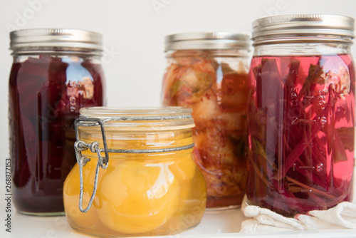 Various jars of fermented and pickled food