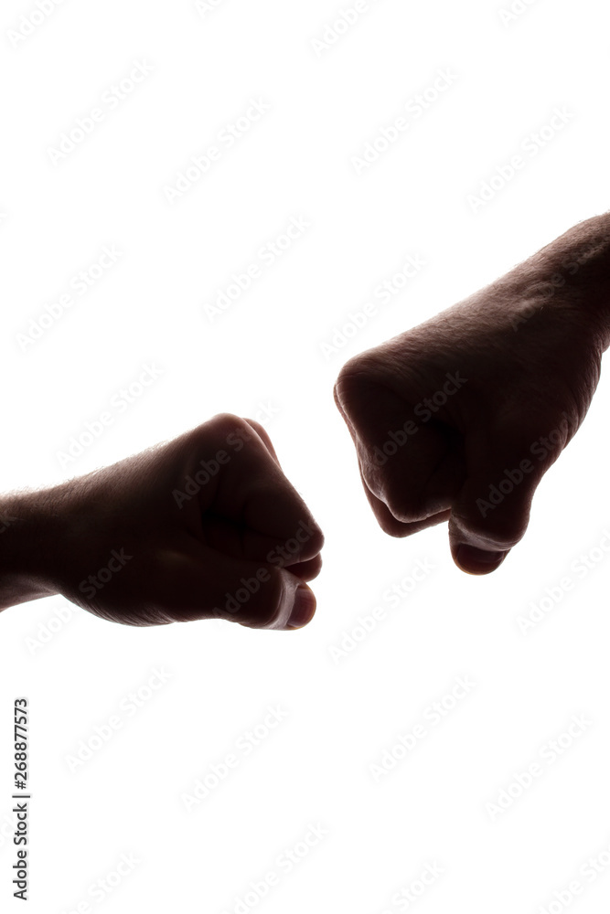 Men's fists clashed, standoff - silhouette Men's fists clashed, standoff - silhouette