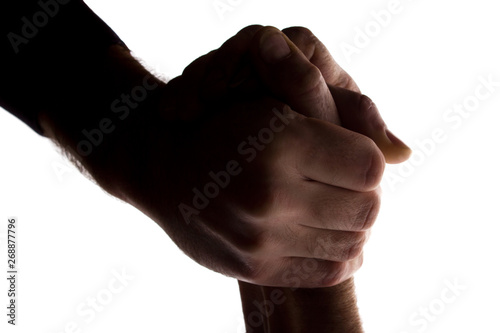 The outstretched hands of young and elderly men, help - silhouette