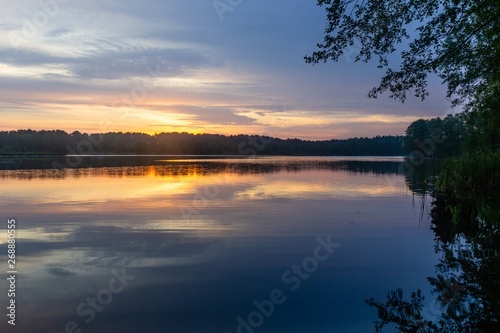 Lake during cloudy sunrise