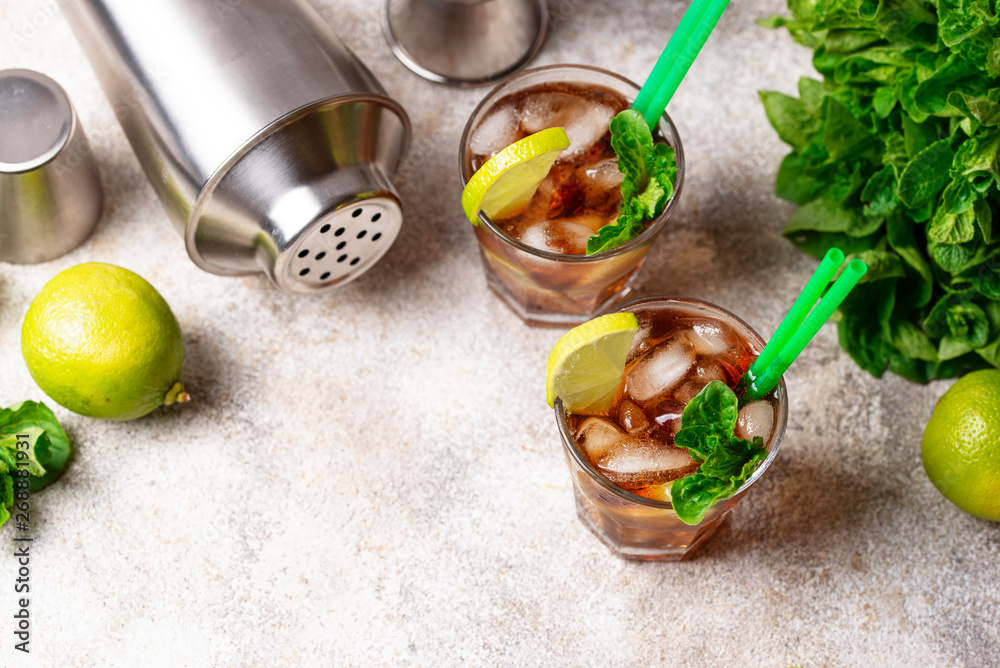 Cuba libre cocktail with mint and lime Cuba libre cocktail with mint and lime