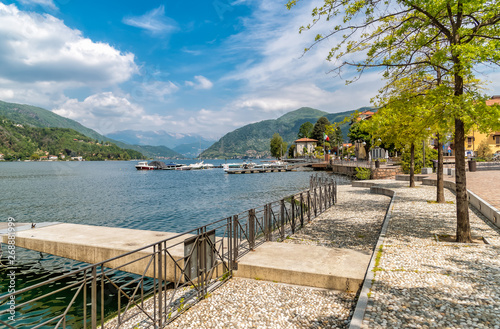 Pedestrian walk along the lake Lugano in delicious little town Porto Ceresio, Italy