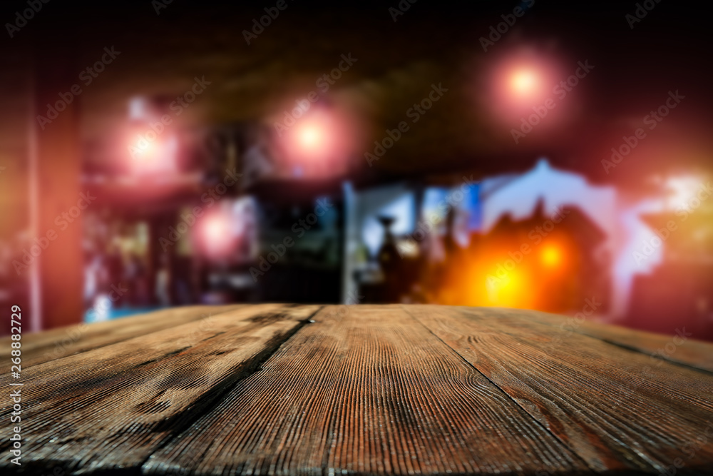 Desk of free space and blurred bar background 