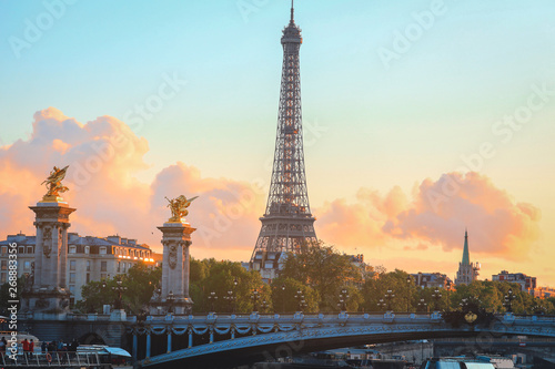 Eiffel Tower at sunset in Paris, France. Romantic travel background. Eiffel tower is traditional symbol of paris and love. © nonglak