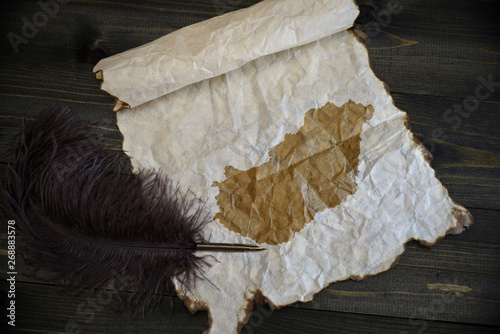 map of hungary on vintage paper with old pen on the wooden texture desk photo