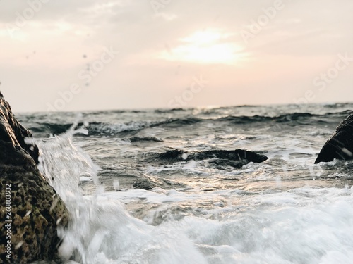 waves crashing on rocks
