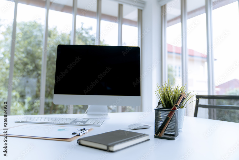 Fototapeta premium Modern white desk work table with computer laptop and stationary in home office