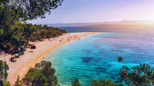 Zlatni Rat (Golden Cape or Golden Horn) famous turquoise beach in Bol town on Brac island, Dalmatia, Croatia. Zlatni Rat sandy beach at Bol on Brac island of Croatia in summertime.