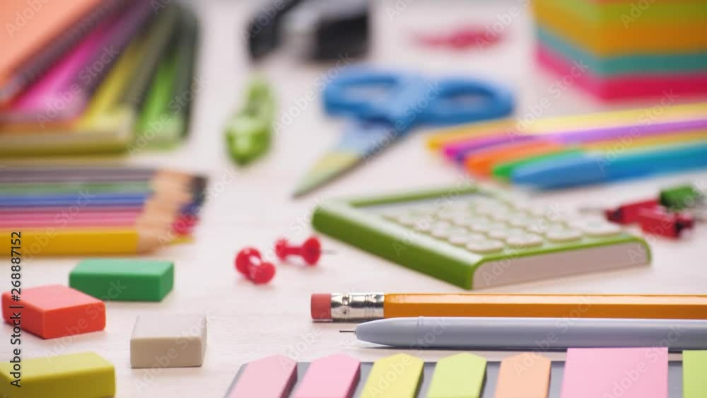 Shot of a school desk with different colorful supplies. Sliding focus. 4k. Shot of a school desk with different colorful supplies. Sliding focus. 4k.