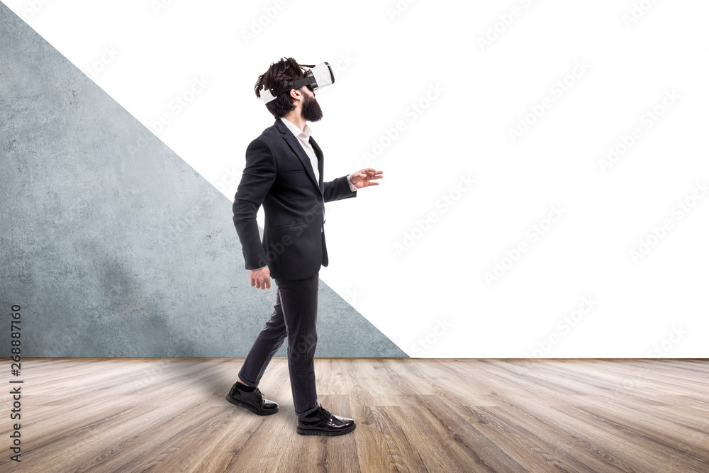 businessman in virtual reality glasses walking  in an empty room