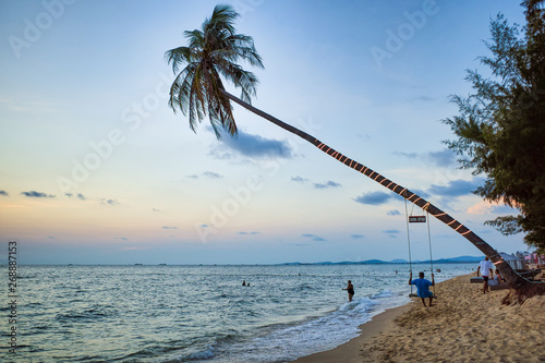 Swing on a palm tree. Sea beach at sunset. Spa Romance, Phu Quoc island, Vietnam