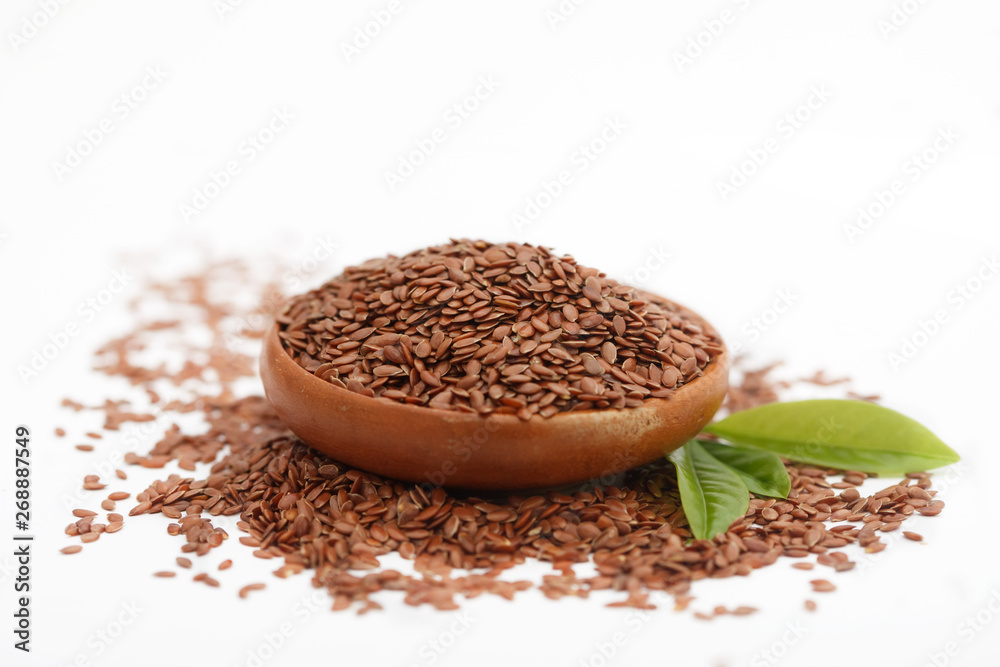 Brown flax seed or linseed in small bowl on white background. Healthy food. Brown flax seed or linseed in small bowl on white background. Healthy food.