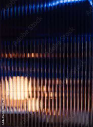 Polycarbonated sheetilluminated with lighting in repeat pattern / interior material lighting concept / abstract concept / background texture