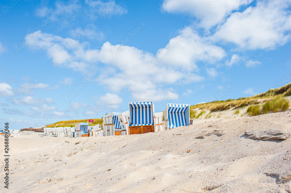 Beach in Westerland with the typical german roofed beach chairs or " Strandkorb" and white sand, Sylt island, North Sea, Germany Stock Photo |  Adobe Stock