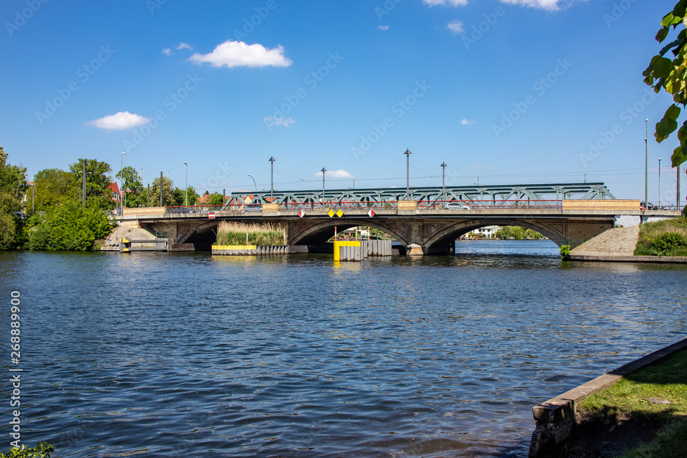 Romantic views of the river Dahme and Spree in Berlin Koepenick with houses on the shore, bridges, ships and boats