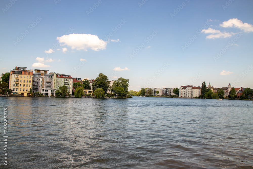 Romantic views of the river Dahme and Spree in Berlin Koepenick with houses on the shore, bridges, ships and boats