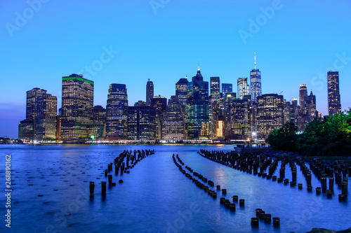Manhattan panoramic skyline at night from Brooklyn Bridge Park. New York City
