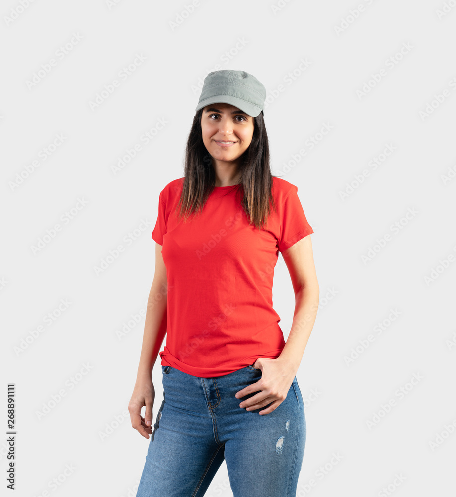 Young girl wearing blank red t-shirt, cap blue jeans. Grey background Stock Photo | Adobe Stock