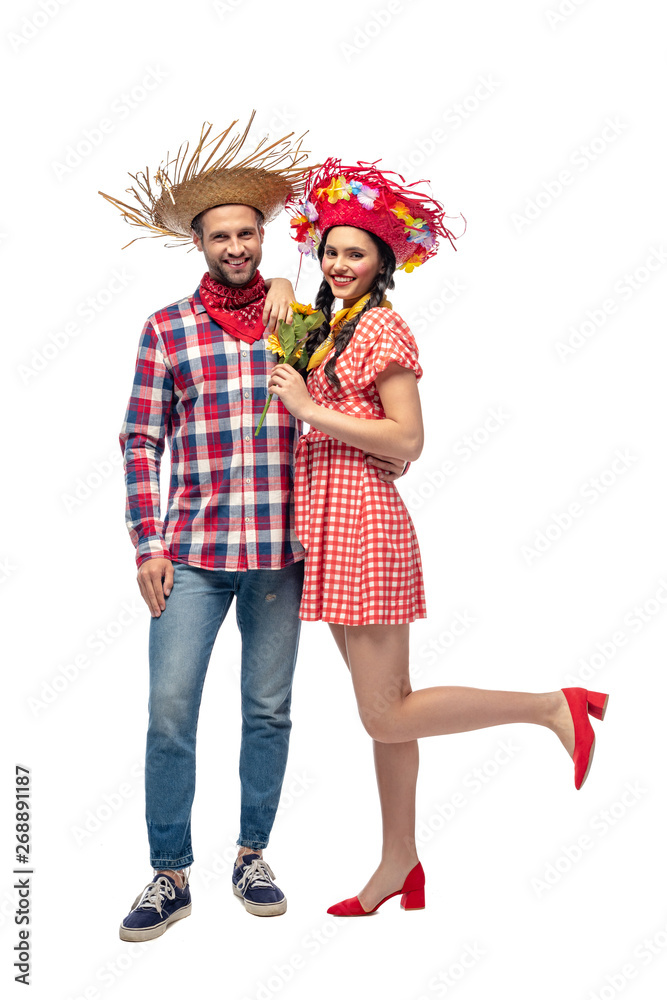 happy man and young woman in festive clothes with sunflowers isolated on white happy man and young woman in festive clothes with sunflowers isolated on white