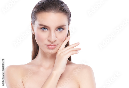 Beauty Young woman with perfect facial skin. Gestures for advertisement treatment spa and cosmetology. empty copy space.
