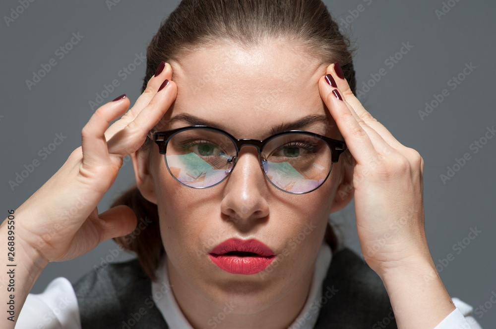 Tired young businesswoman or office worker Tired young businesswoman or office worker