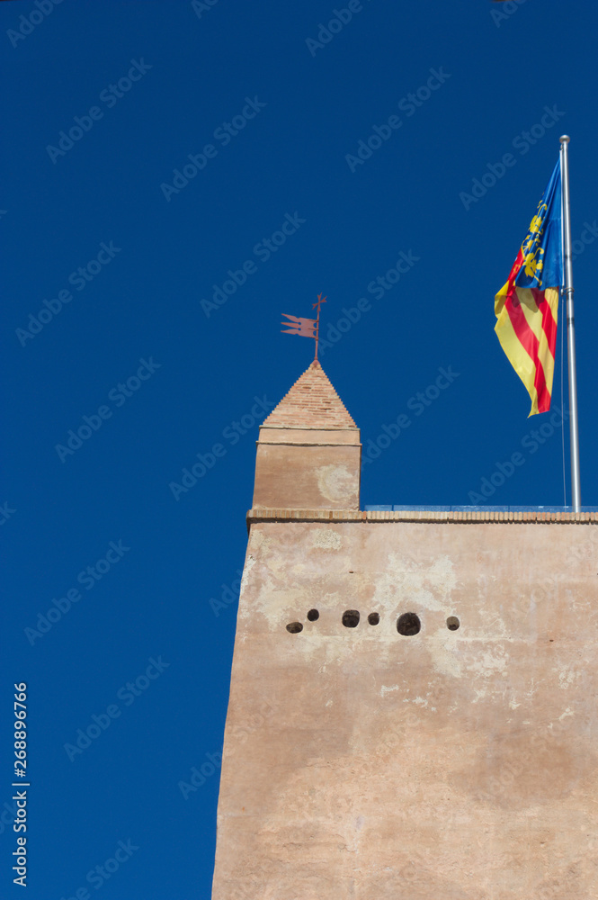 The Tower of Torrent with the Valencian flag.
