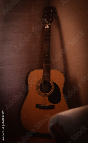 acoustic guitar in the corner of the room. loft style