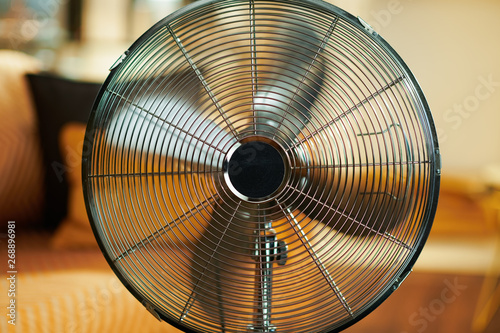 Closeup on working metallic floor standing fan