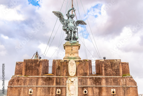 Photography Bronze statue of Michael the Archangel on the top of the Castel Sant'Angelo, Rom