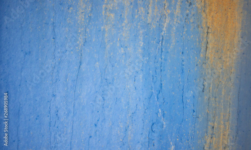 Rusty blue metal wall texture background, old sheet of iron covered with rust and blue color.