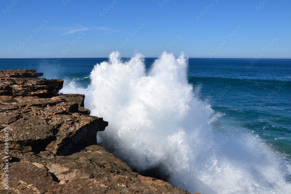 Big ocean waves crashing against the rocks at the west coast of the island of Fuerteventura, Spain. Beauty and power of the nature