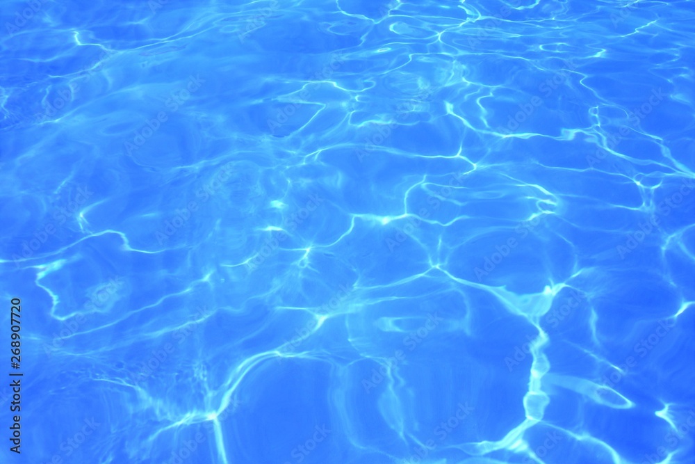 Blue ripped water in the swimming pool Swimming pool water surface background