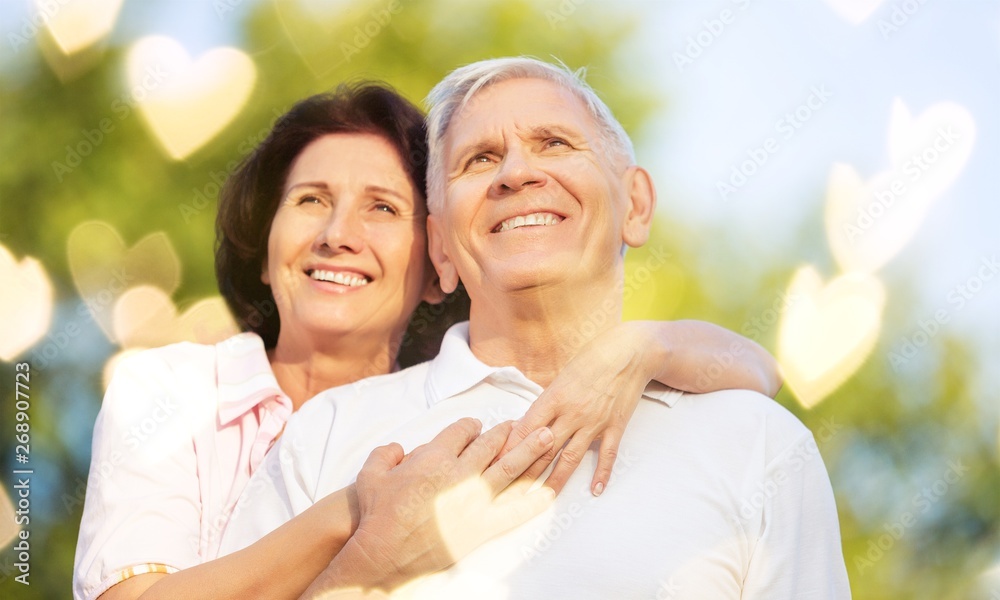 Close-up portrait of an elderly couple hugging Close-up portrait of an elderly couple hugging