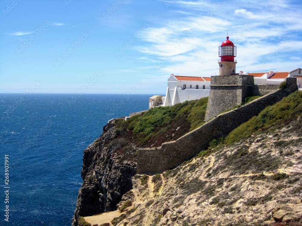 Lighthouse at the Cape St. Vincent (Lighthouse of Cabo de São Vicente), located on a high cliff. The most southwestern point of Portugal and of mainland Europe