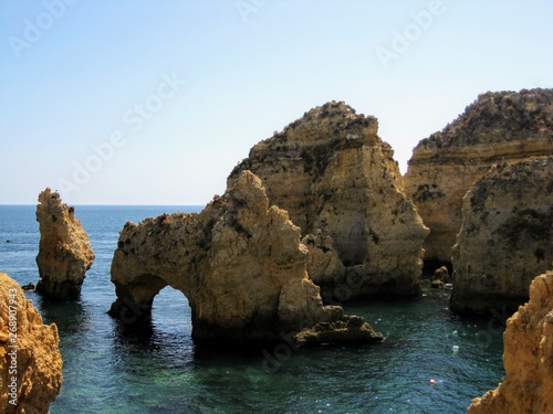 Algarve coast with rocky formations. Atlantic coast landscape in Algarve region. Seashore and caves near Lagos, Portugal, Europe