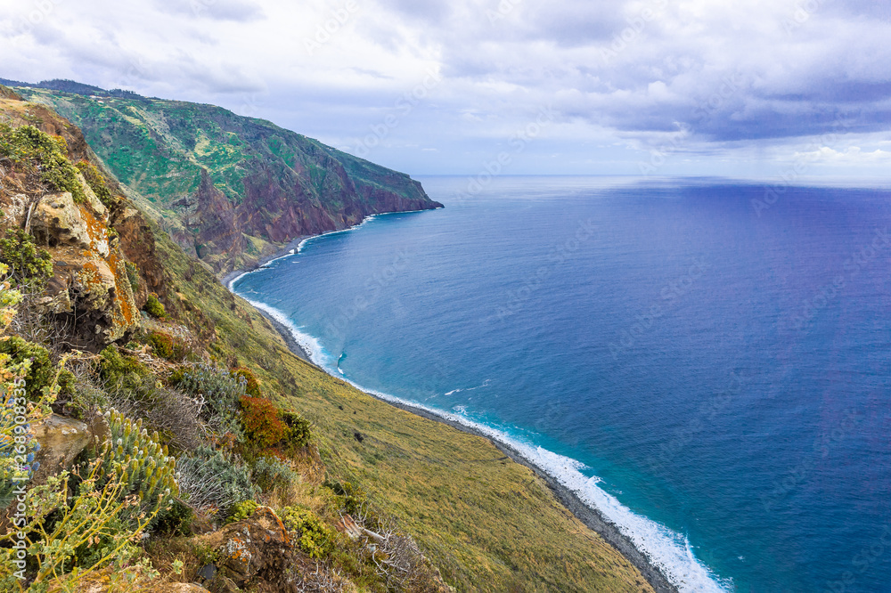 Aerial Madeira island view with Atlantic ocean, white waves, cliffs and nature