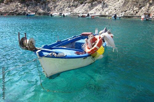Porto Vromi on Zakynthos Island. Fishing boats and clear, turquoise water in the blue lagoon of Porto Vromi