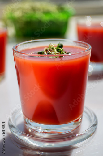 Wallpaper Mural Red tomato juice in a glass, bright morning sun, healthy breakfast Torontodigital.ca