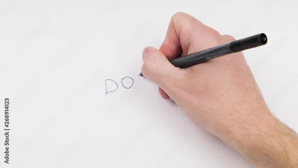 hand in the first person writes phrases on a white background hand in the first person writes phrases on a white background