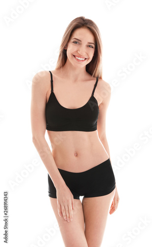 Young slim woman on white background. Perfect body