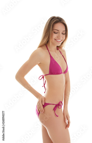 Young slim woman in bikini on white background. Perfect body