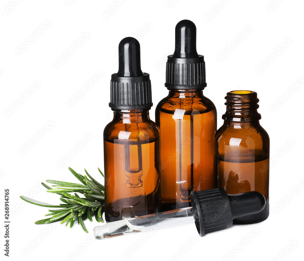 Different bottles of essential oils and rosemary on white background Different bottles of essential oils and rosemary on white background