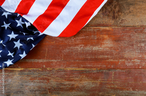 Fototapeta Naklejka Na Ścianę i Meble -  American flag on old wooden board patriotism USA national holidays