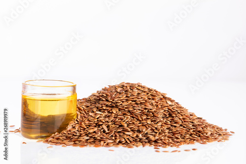 Seeds and linseed oil - Linum usitatissimum. White background photo