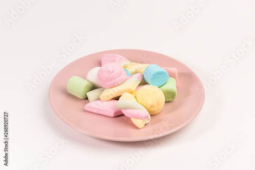 Plate with marshmallow isolated on white background.
