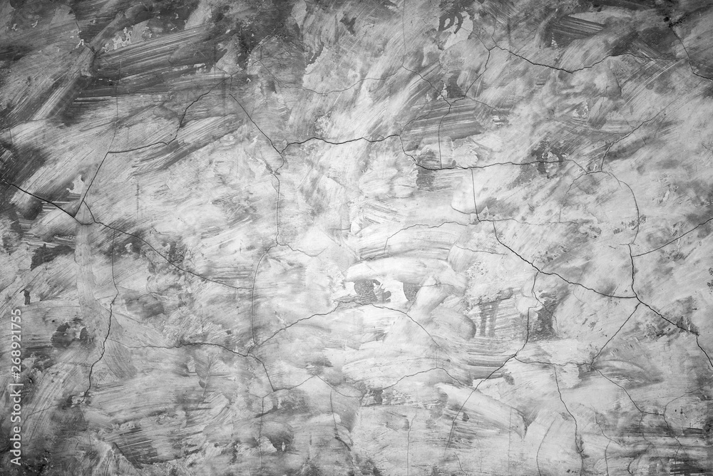Cracked cement wall closeup for background. Old and cracked according to usage and weather conditions. Cracked cement wall closeup for background. Old and cracked according to usage and weather conditions.