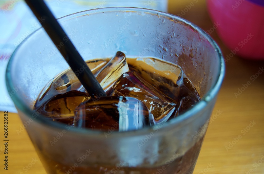 Close up on soda drink and ice in glass Close up on soda drink and ice in glass