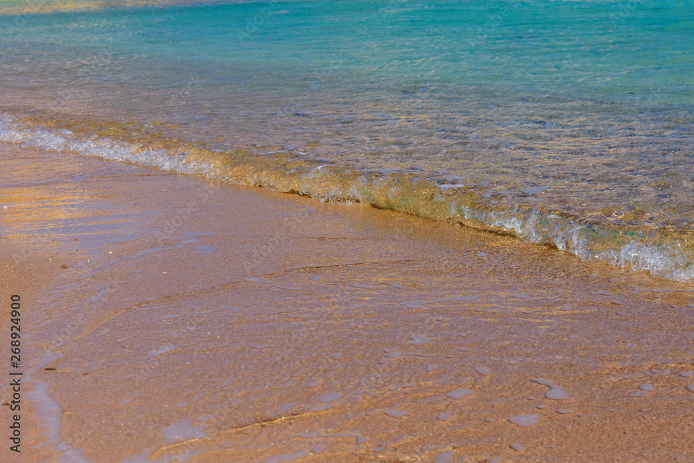 Closeup of the sand on beach and Red sea water Closeup of the sand on beach and Red sea water