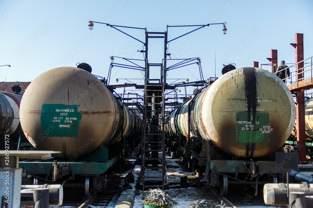 Railway trains with tanks for the transport of petroleum products are on the siding Railway trains with tanks for the transport of petroleum products are on the siding